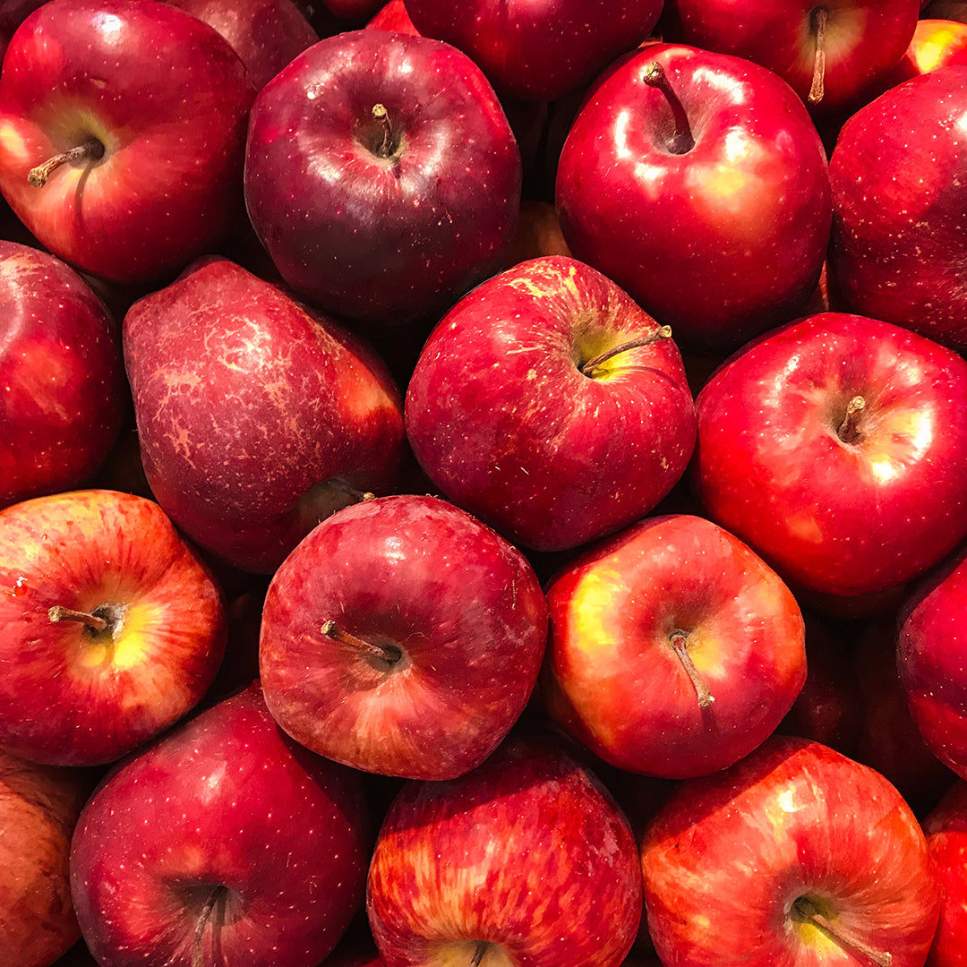 Premium Photo  Lots of tasty apples red organic envy apple new zealand top  view close up for wallpaper background